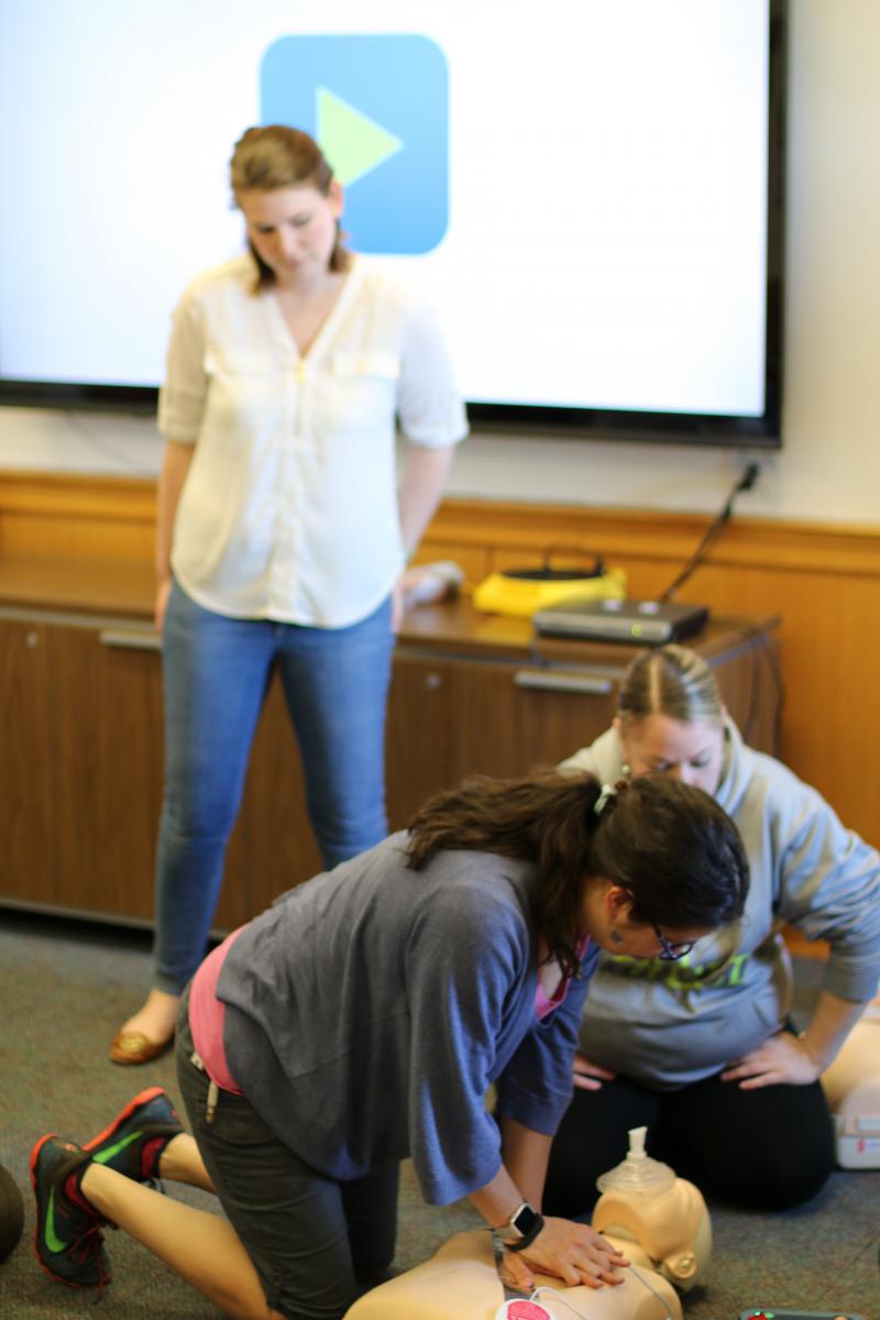 Ruth Elizabeth Miller practices CPR under the watchful eye of Kelly Predmore during a recent CPR/AED training class for Lehigh staff and faculty.