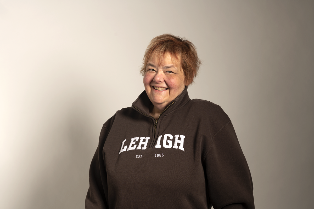 image of MaryAnn Haller, a longtime Lehigh employee who passed away in November 2022. She is smiling and wearing a cozy brown Lehigh fleece sweater