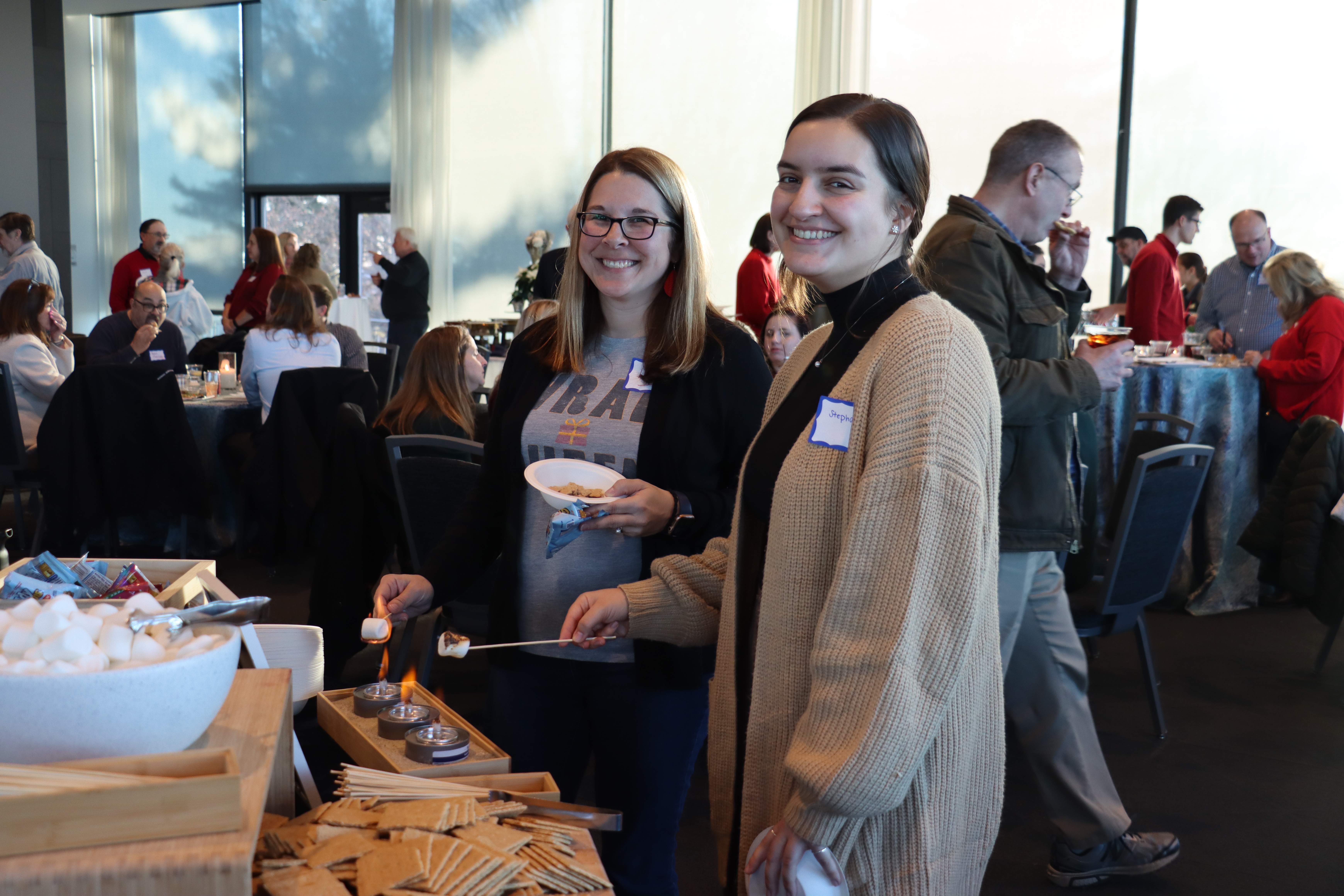 Lehigh employees enjoy making Smores at the Winter Festival in December