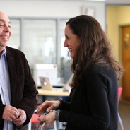 Jim Monek, supervisor and his staff member Amanda Caton, both employees in Lehighs Library and Technology Services stem, stand in the Fairchild Martindale Library and engage in conversation.