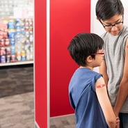 A family receives vaccines at a local pharmacy