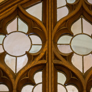 a detail of a leaded glass and wooden window on campus