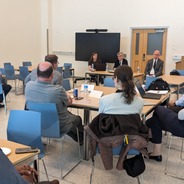 President Helble, Provost Nathan Urban, and Vice President Christine Cook speak at the event to audience.