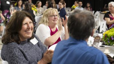 Staff members smile as they celebrate award winners